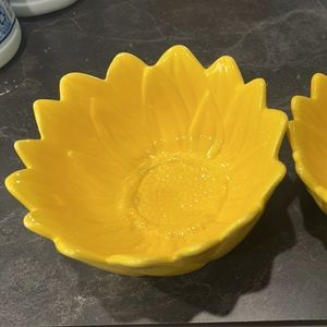 Two yellow glass sunflower bowls